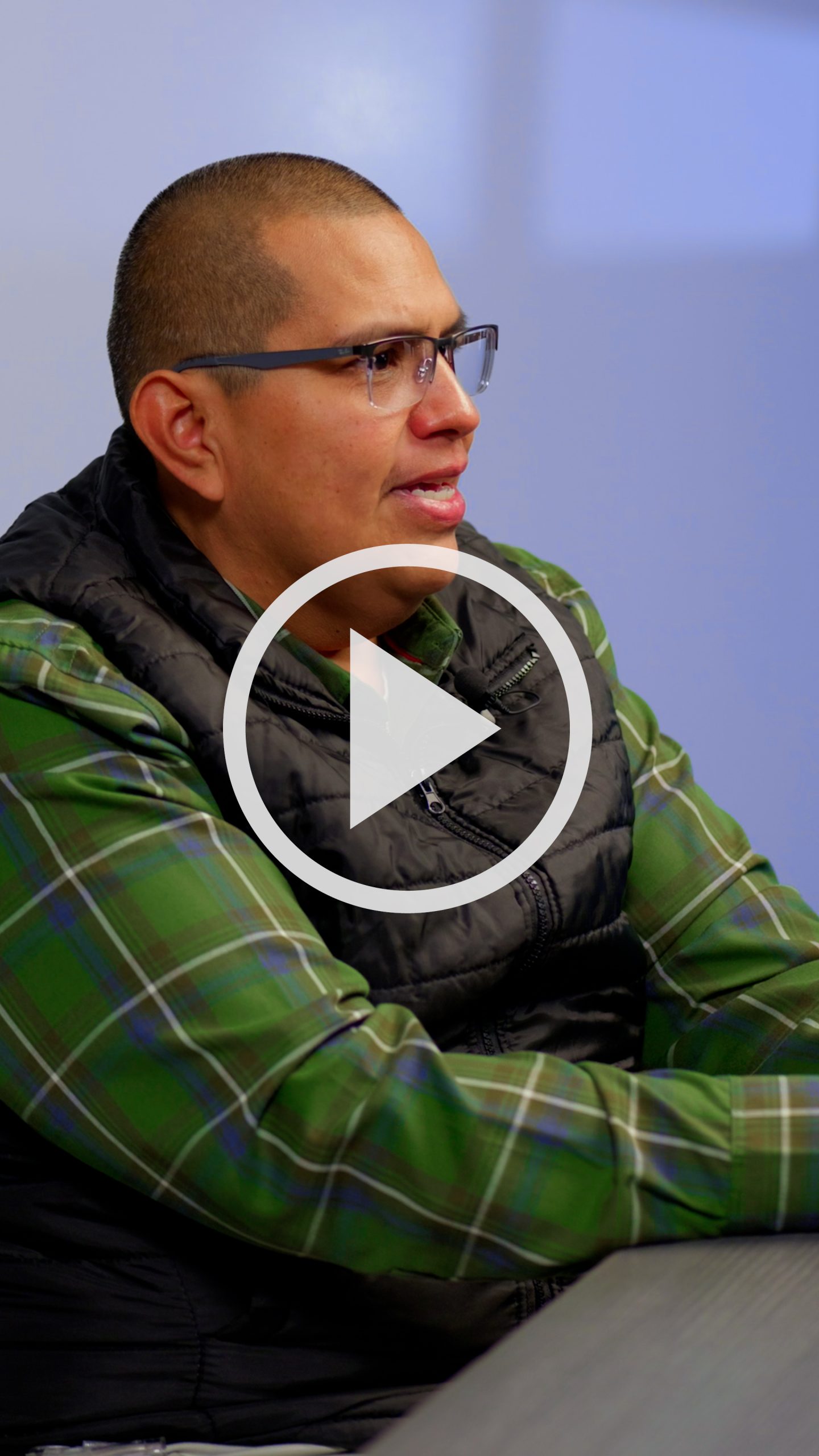 Image of customer service award winner with a play arrow overlay.