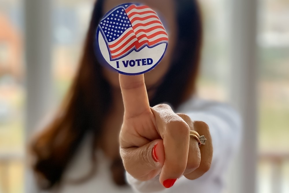 woman holds I loved sticker