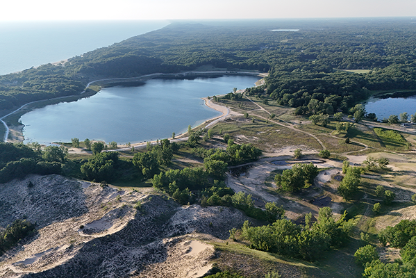 An aerial view of the dunes and shores of Lake Michigan